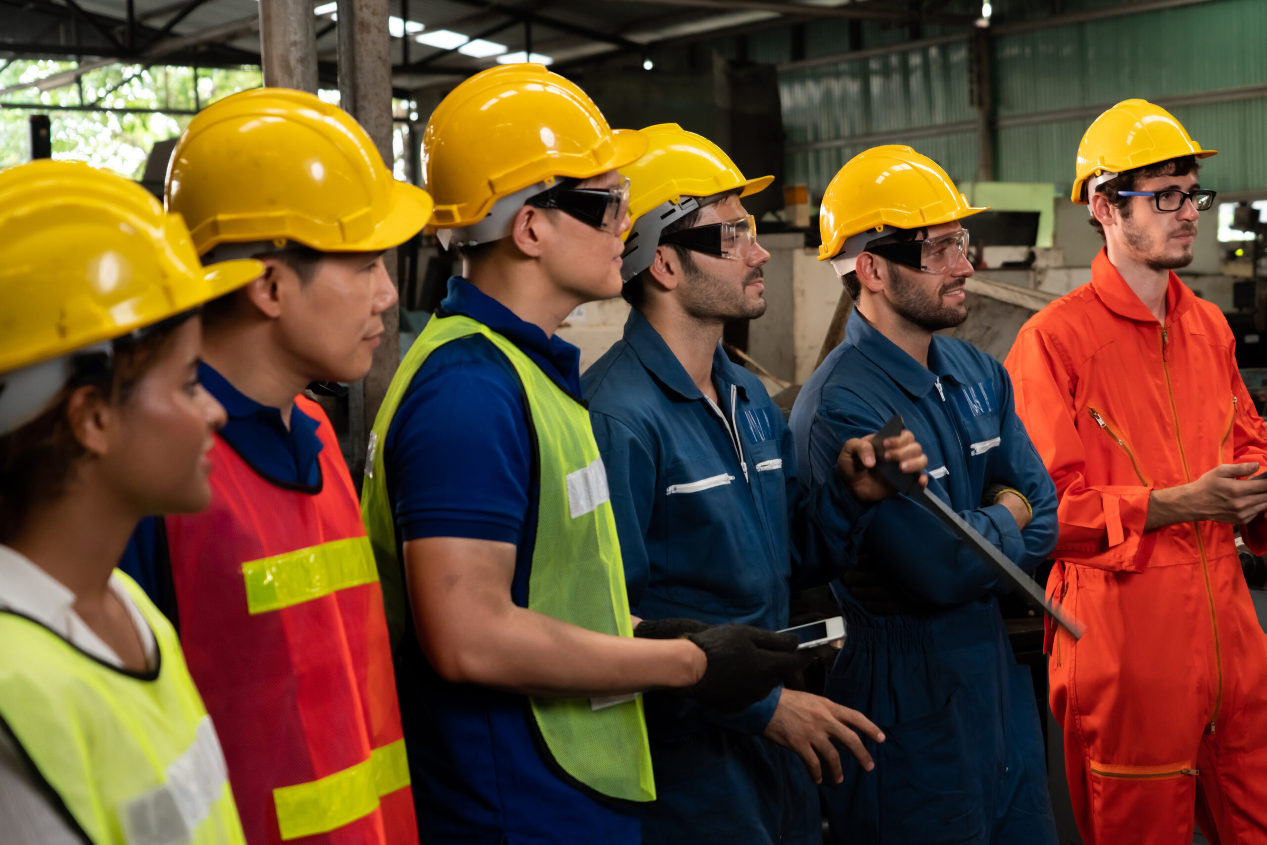 workers attending brief meeting in the factory